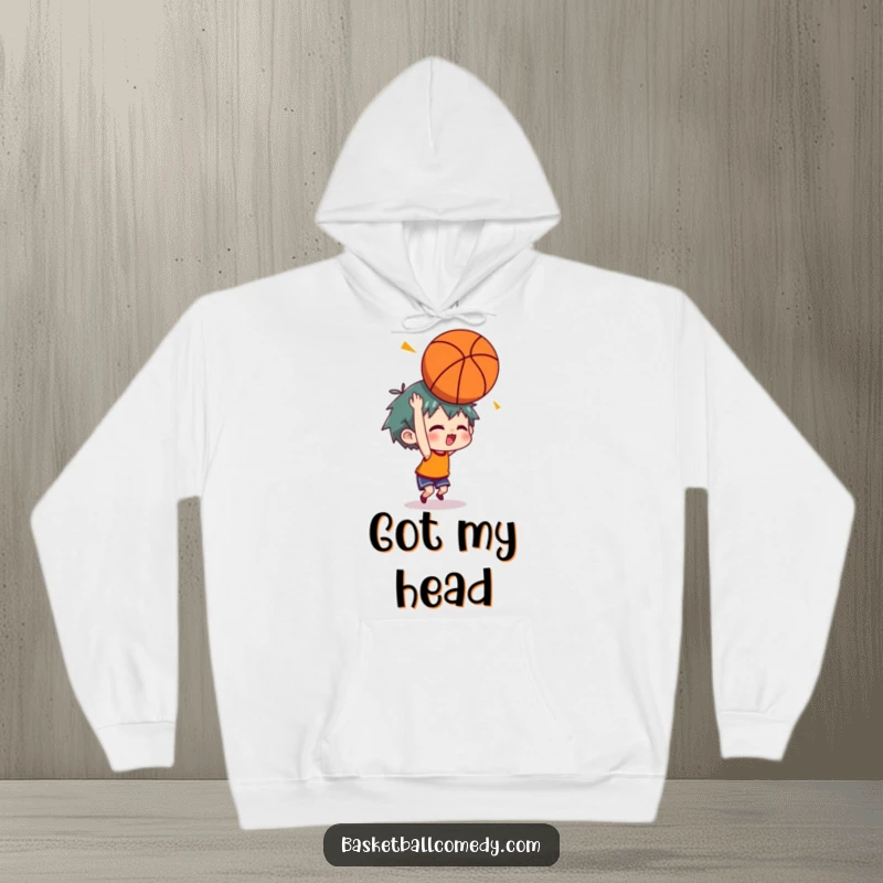 Funny hoodie showing a character looking dazed after a basketball bounces off their head, with comical stars indicating impact.